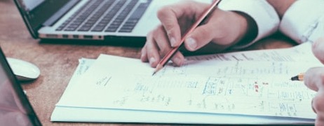 Workspace with laptop and documents representing affordable managed hosting